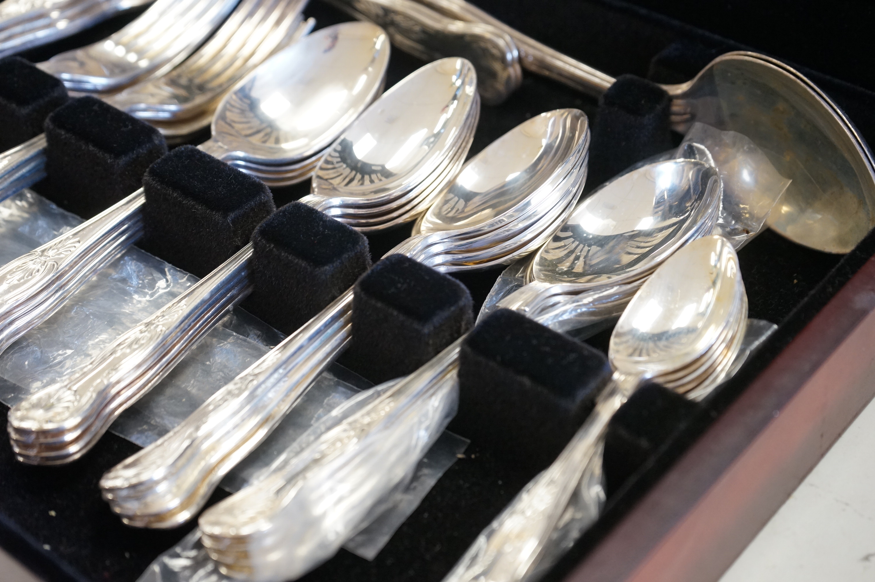 Four cased canteens of silver plated flatware including Kings pattern and Mappin plate